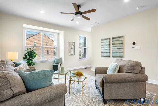 a living room with furniture and a large window