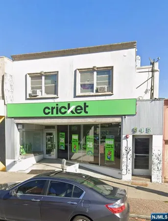 front view of a house with a large window