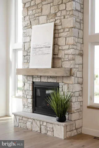 a kitchen with stainless steel appliances granite countertop a refrigerator a stove and a sink