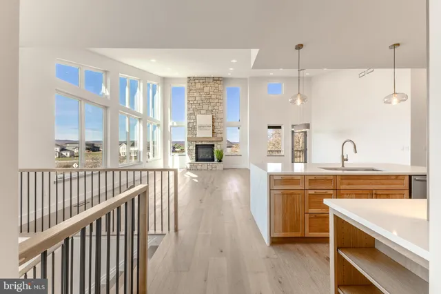 a view of empty room with window and ceiling fan