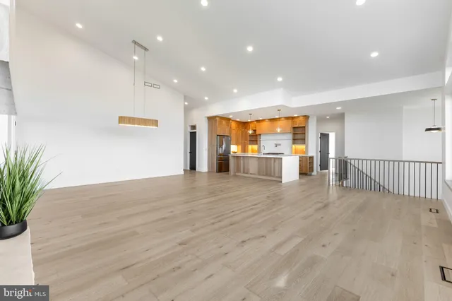 a bathroom with a granite countertop bathtub sink and mirror