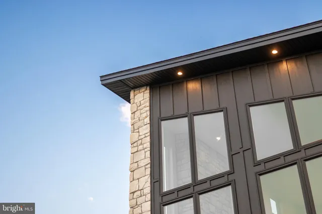 a front view of a house with a glass windows