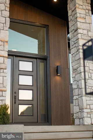a kitchen with a sink and chandelier