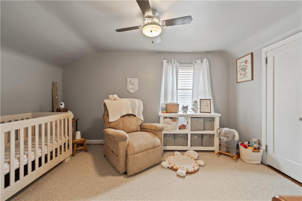 315 Vanadium Road Pittsburgh, PA 15243 - Photo 18 of 39 a bedroom with furniture and a window