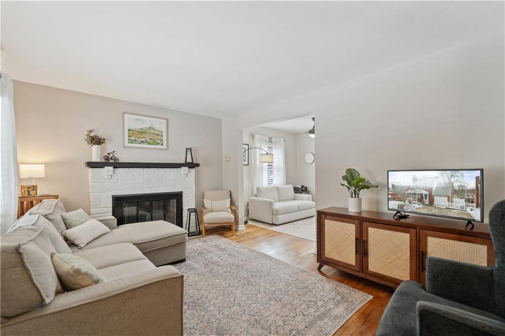 315 Vanadium Road Pittsburgh, PA 15243 - Photo 2 of 39 a living room with furniture and a fireplace