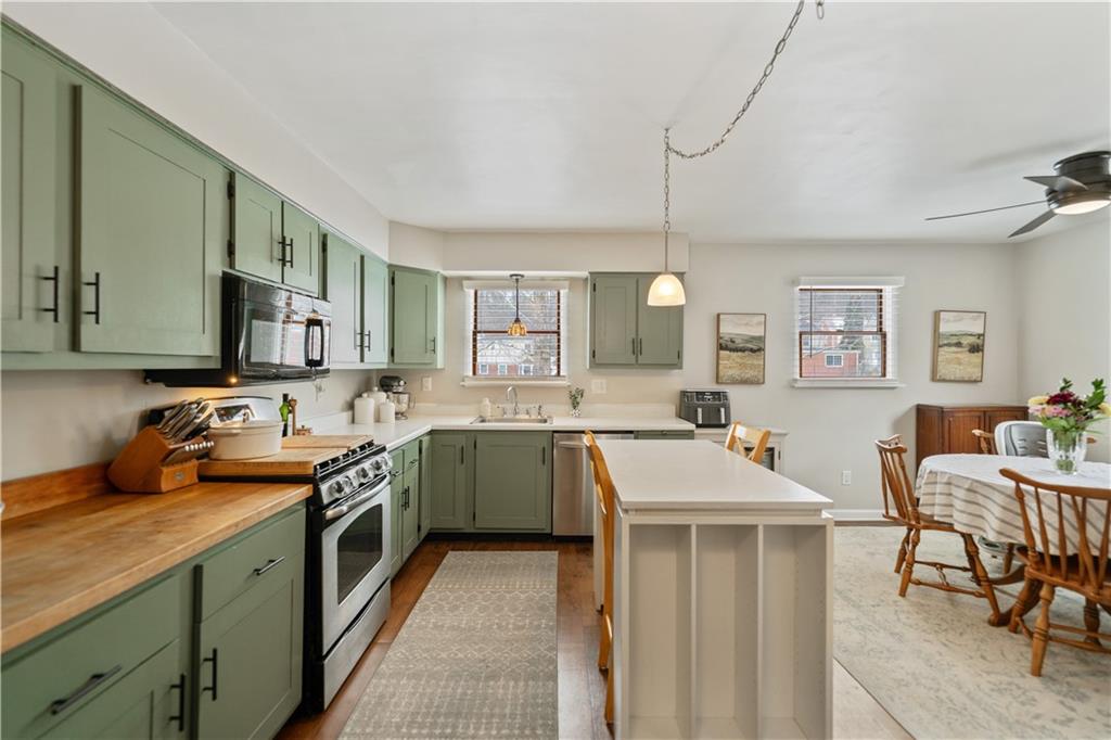 315 Vanadium Road Pittsburgh, PA 15243 - Photo 8 of 39 a kitchen with a sink stove and cabinets