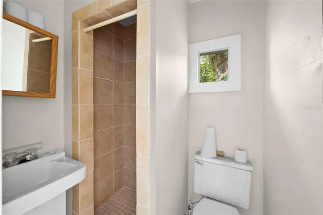 a view of room with hardwood floor and ceiling fan