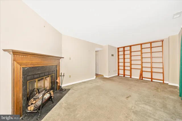 a view of a balcony with wooden floor and fence