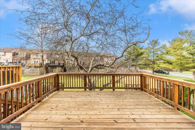 a view of a swimming pool and a cars park