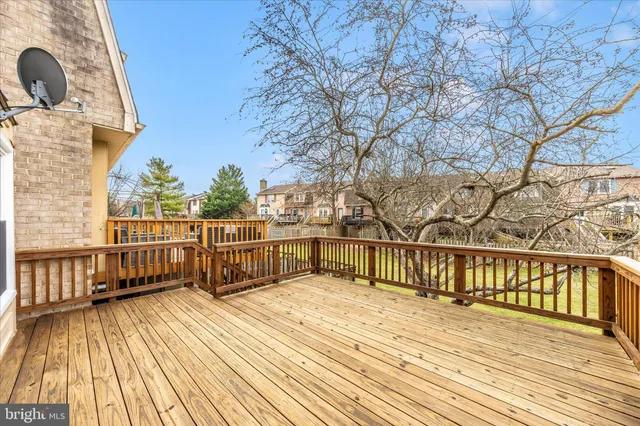an aerial view of a house with pool garden and outdoor seating