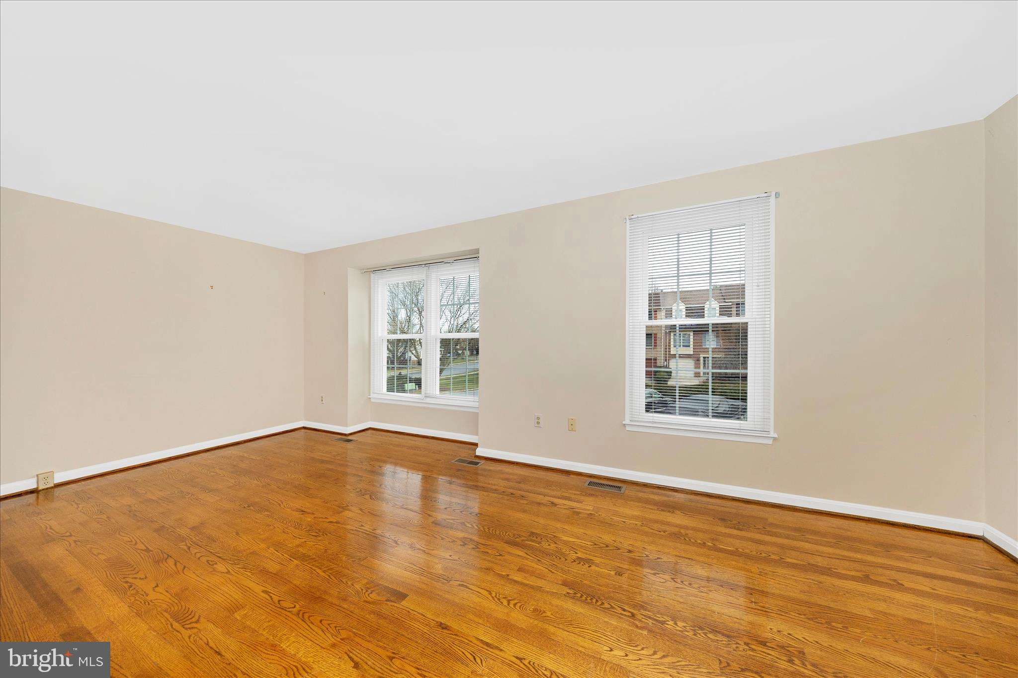 8007 Broken Reed Court Frederick, MD 21701 - Photo 6 of 72 an empty room with wooden floor and windows