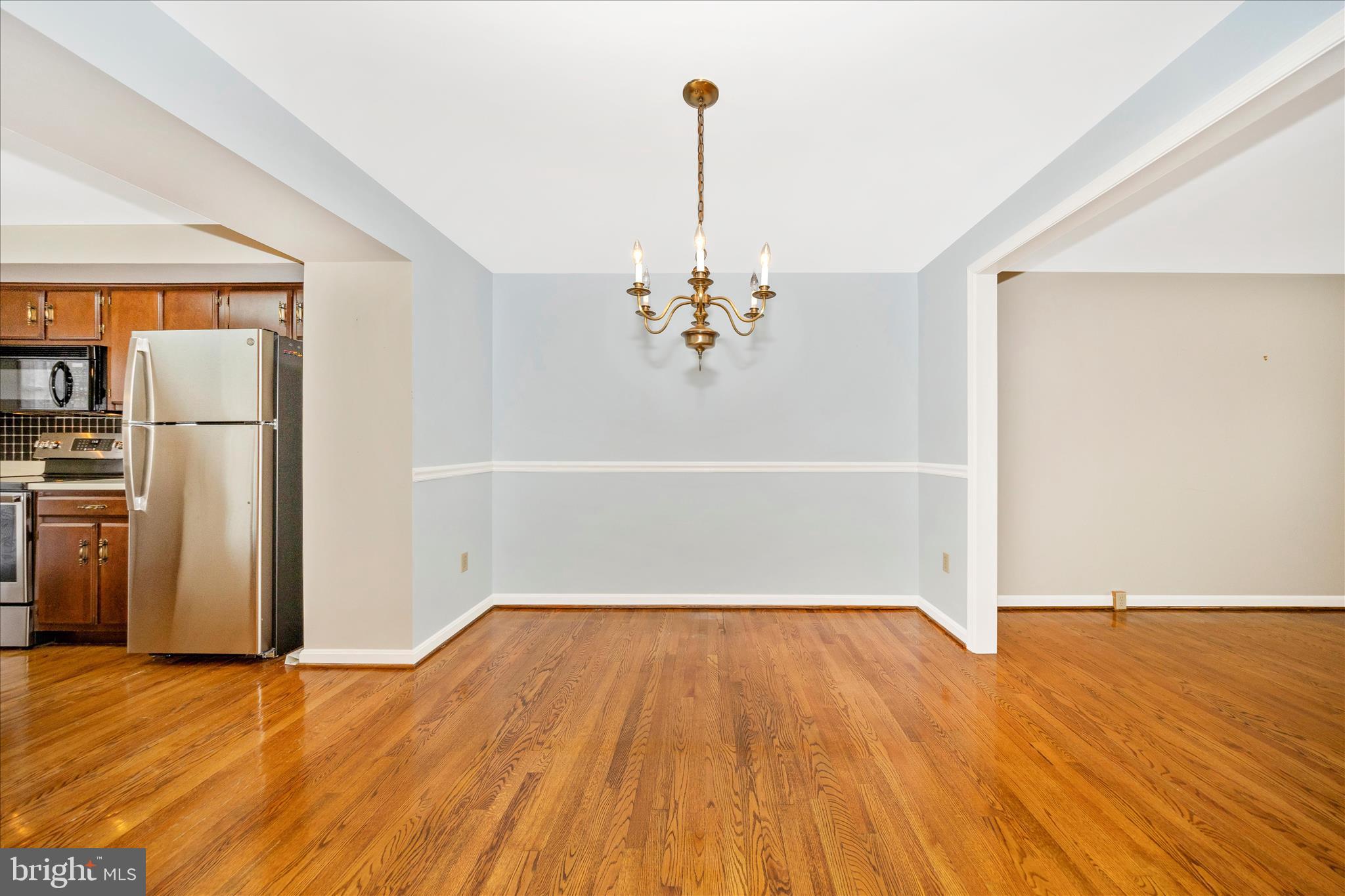 8007 Broken Reed Court Frederick, MD 21701 - Photo 8 of 72 a view of empty room with wooden floor and window