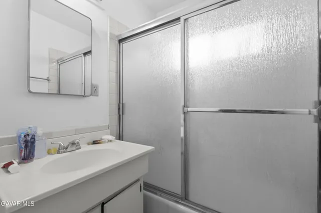 a bathroom with a sink and mirror