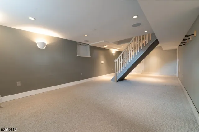 a view of an empty room with stairs
