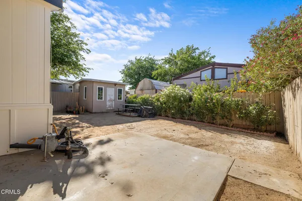 a view of backyard of a house