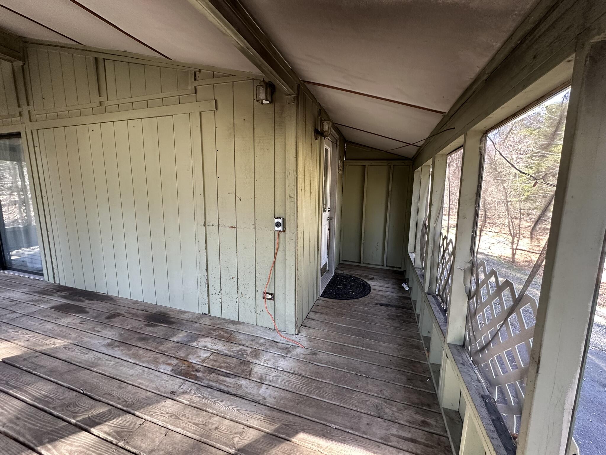 6 Old Post Road Tobyhanna, PA 18466 - Photo 4 of 32 a view of a porch with wooden floor and stairs