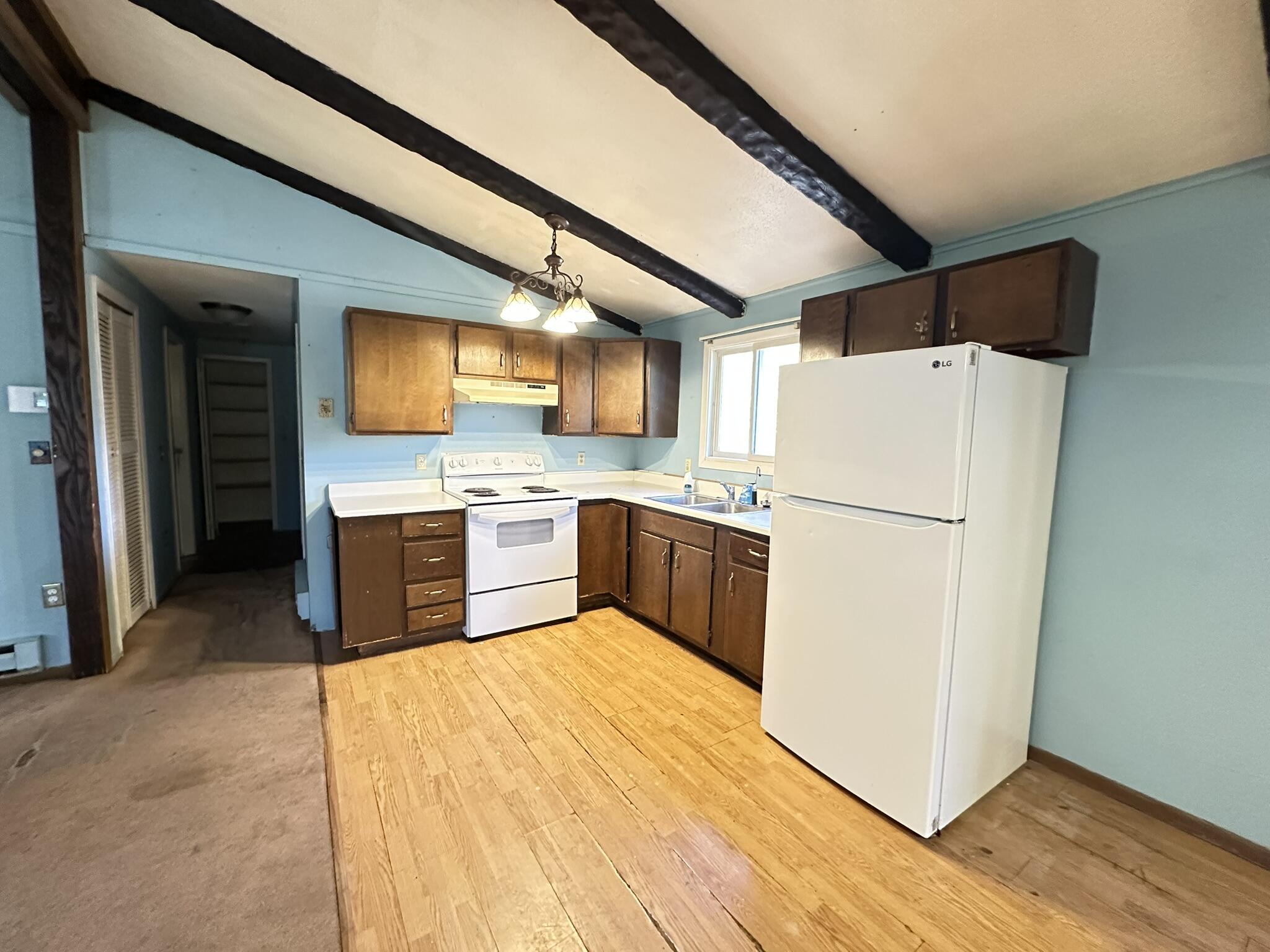 6 Old Post Road Tobyhanna, PA 18466 - Photo 8 of 32 a kitchen with sink cabinets and white appliances