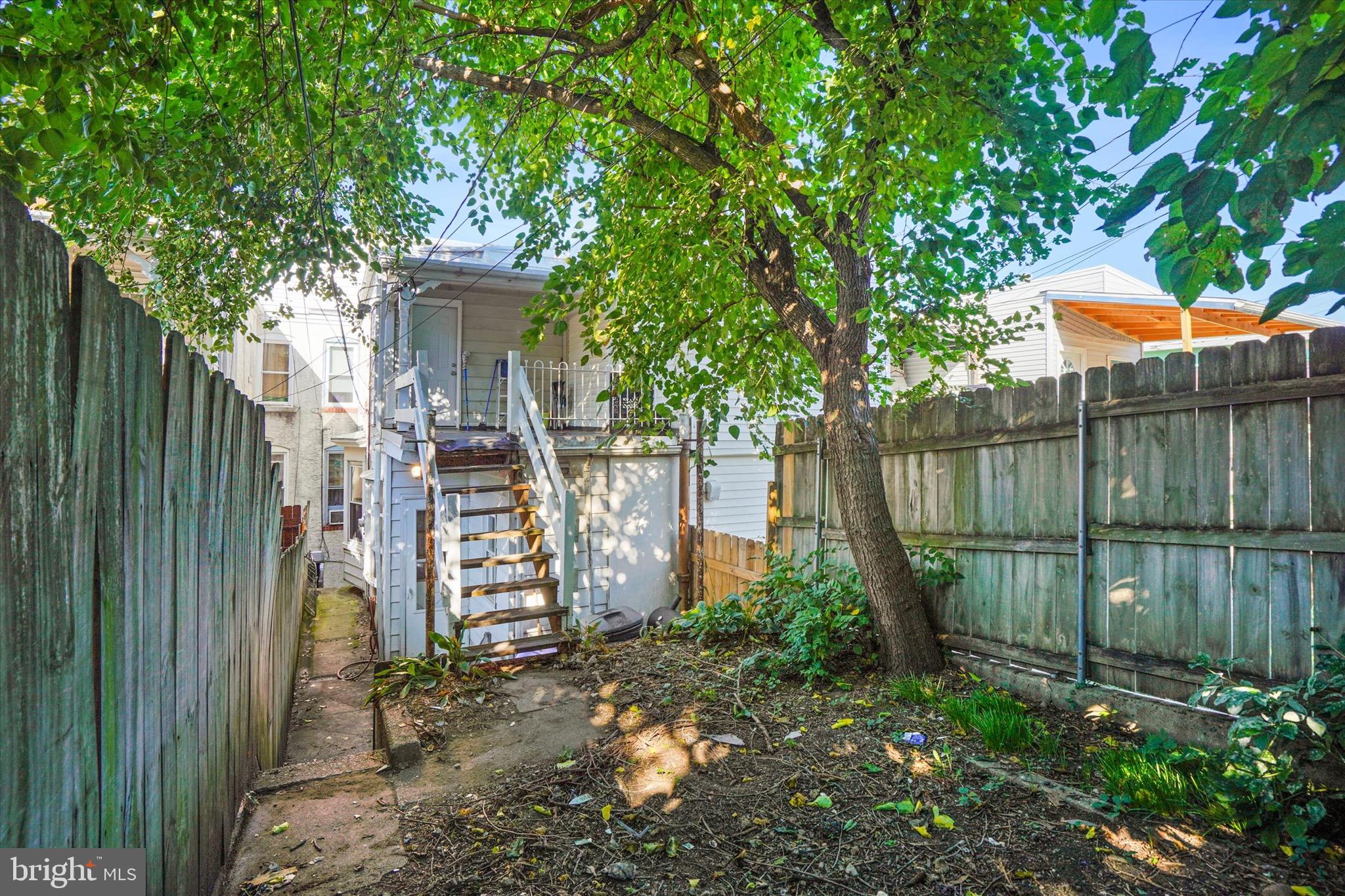 933 North 12th Street Reading, PA 19604 - Photo 18 of 26 a view of a backyard with plants and tree