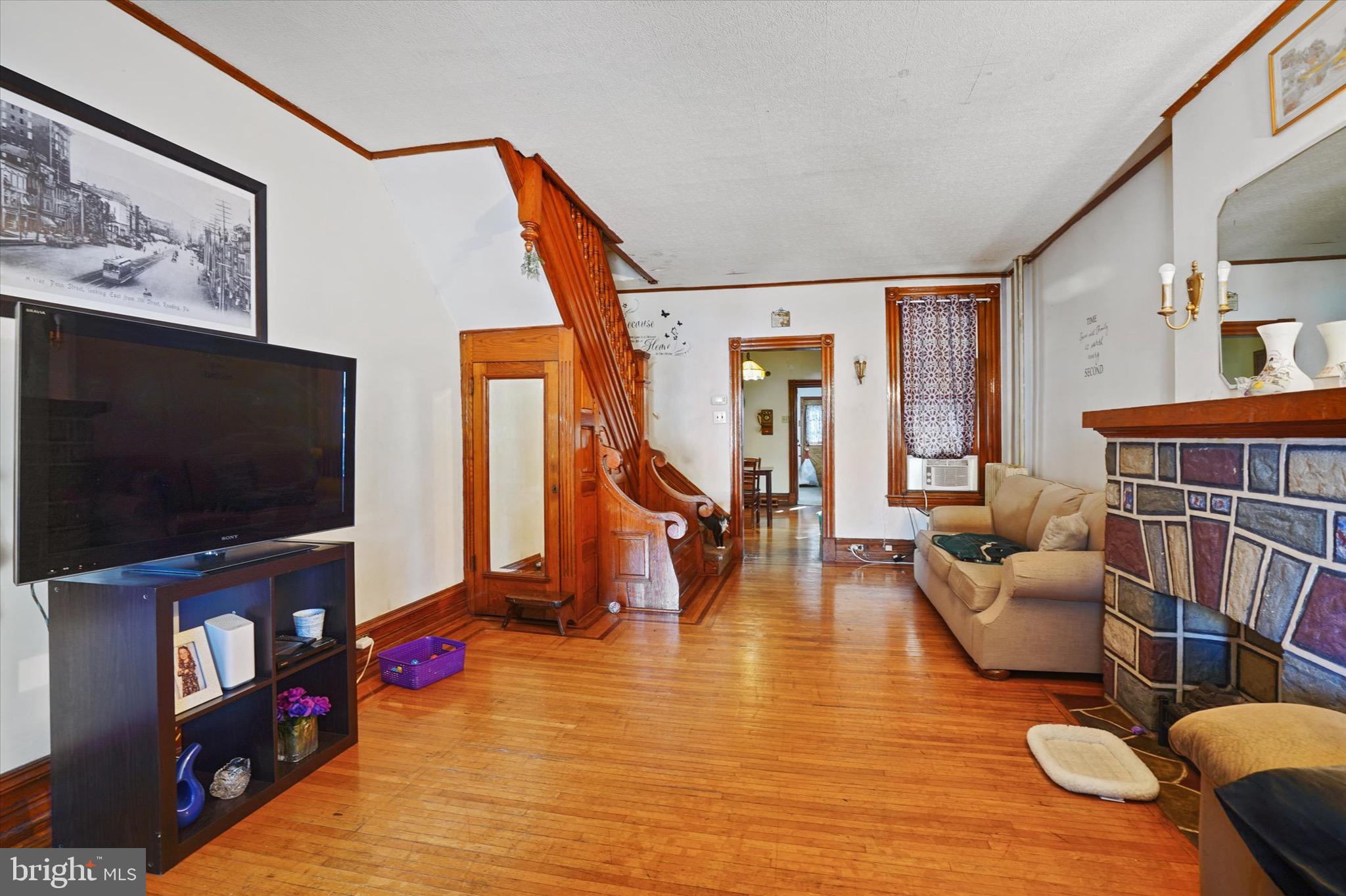 933 North 12th Street Reading, PA 19604 - Photo 6 of 26 a living room with furniture and a flat screen tv
