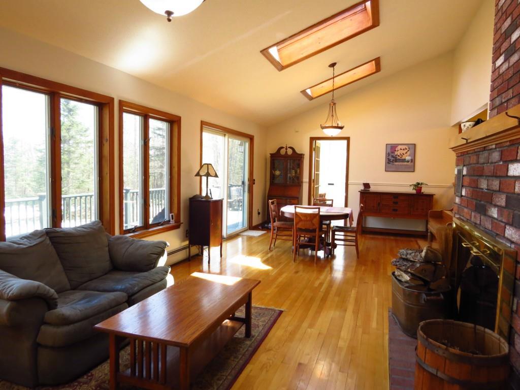 2 Fort Point Cove Road Stockton Springs, ME 04981 - Photo 9 of 35 living room and dining area both...