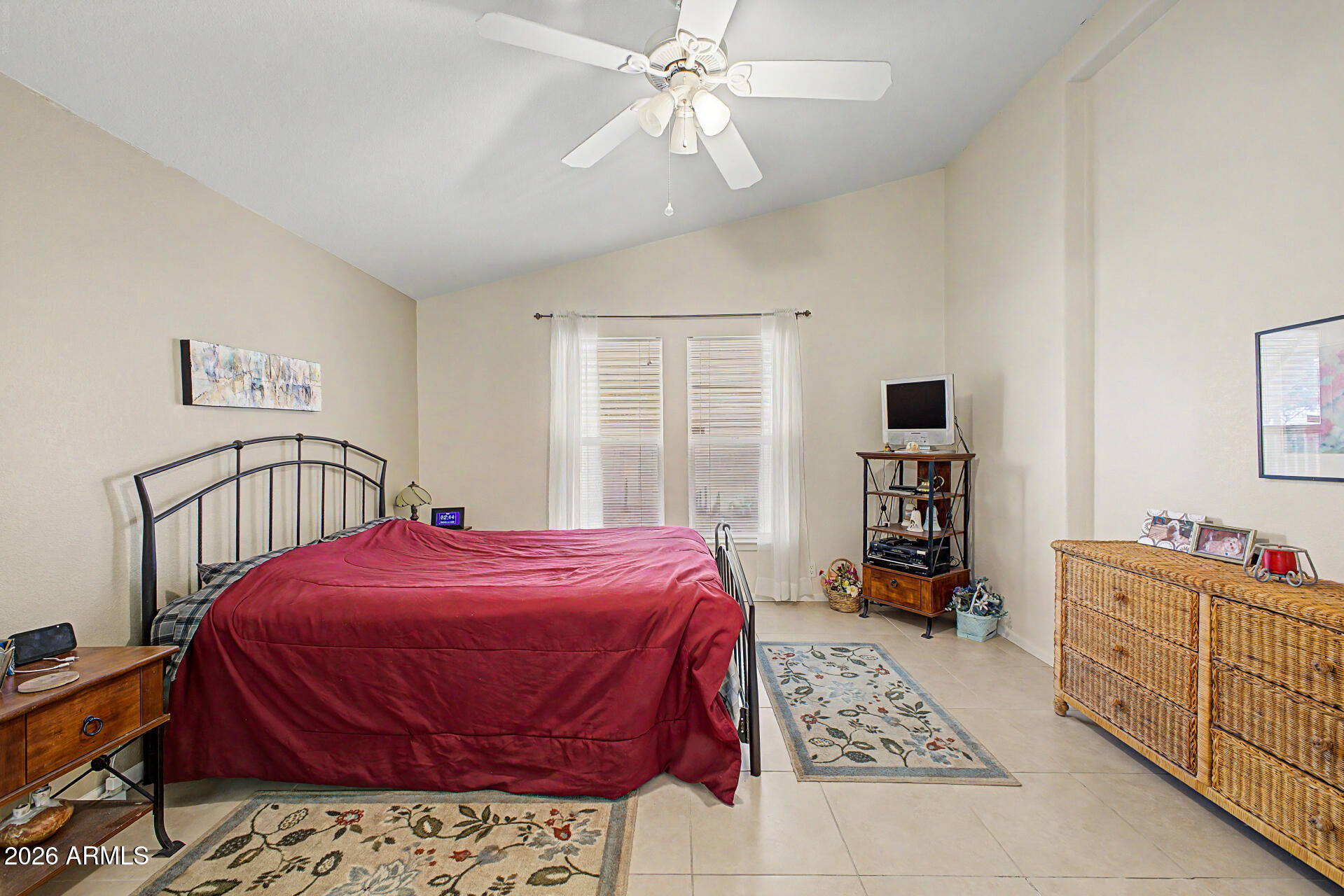 2101 South Meridian Road, Unit 45 Apache Junction, AZ 85120 - Photo 16 of 36 a bedroom with a bed and a dresser in it
