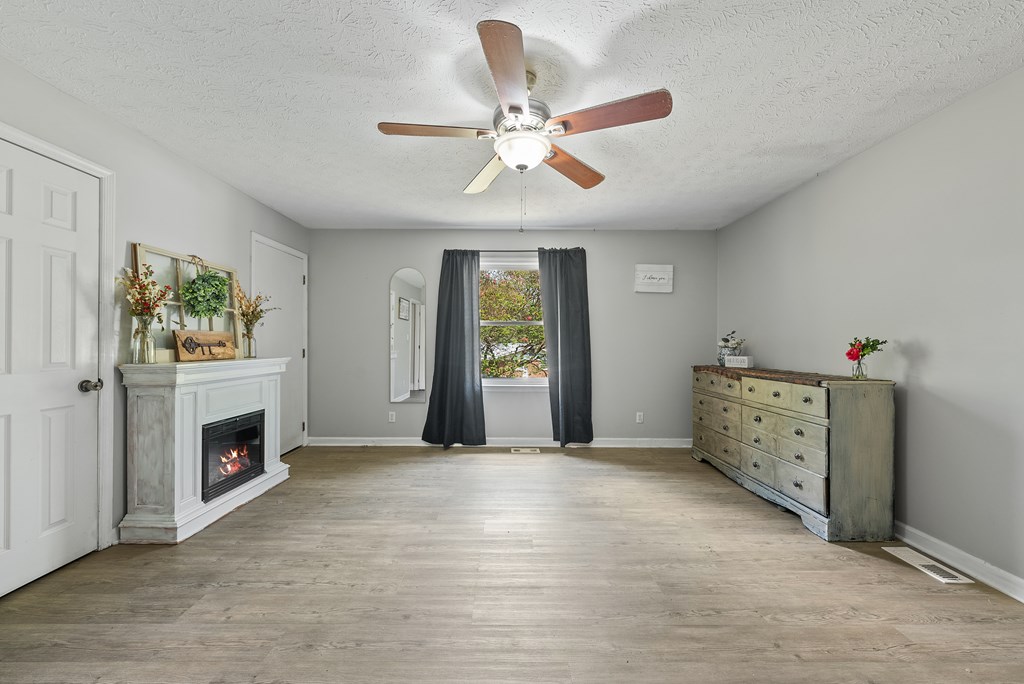 831 53rd Street Columbus, GA 31904 - Photo 12 of 37 a view of an empty room with a fireplace and a window