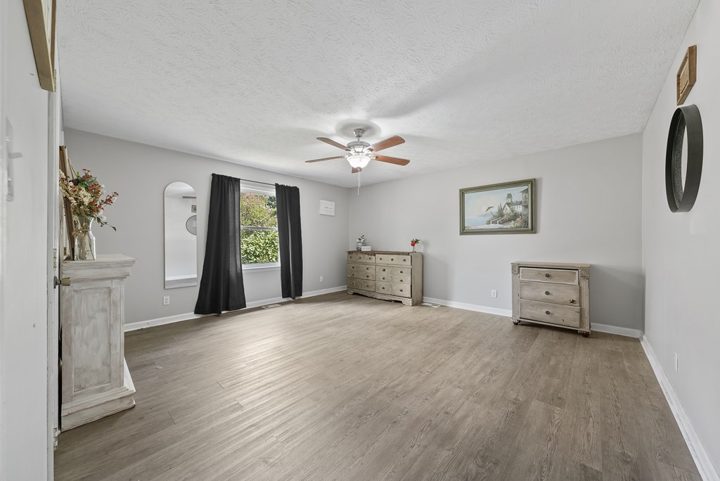 831 53rd Street Columbus, GA 31904 - Photo 13 of 37 a view of an empty room with window and wooden floor