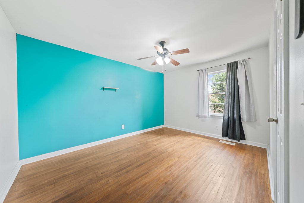 831 53rd Street Columbus, GA 31904 - Photo 18 of 37 wooden floor in an empty room with a window