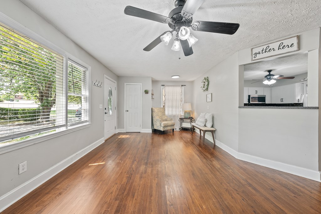 831 53rd Street Columbus, GA 31904 - Photo 2 of 37 a view of an empty room with wooden floor and a window
