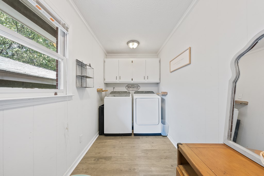 831 53rd Street Columbus, GA 31904 - Photo 23 of 37 a utility room with cabinets washer and dryer
