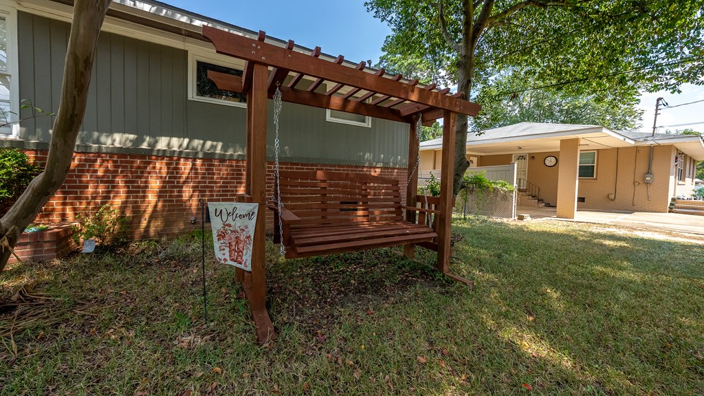 831 53rd Street Columbus, GA 31904 - Photo 33 of 37 a backyard of a house with barbeque oven table and chairs