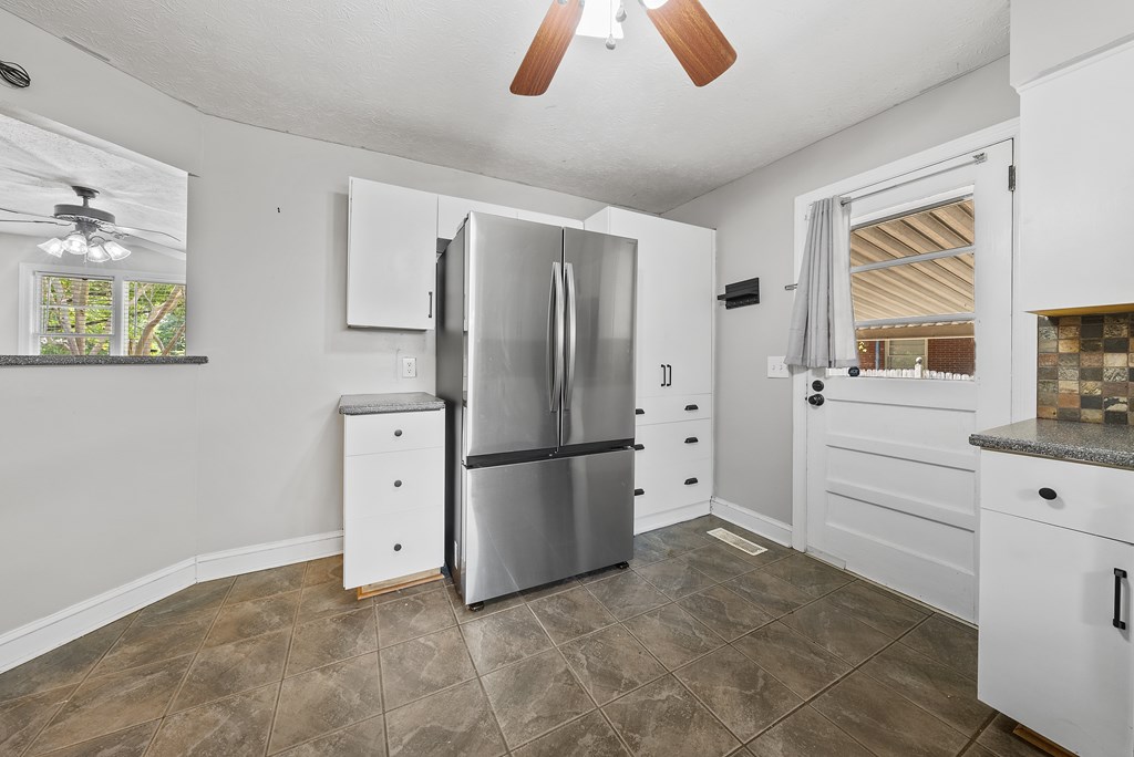831 53rd Street Columbus, GA 31904 - Photo 10 of 37 a kitchen with stainless steel appliances a refrigerator sink and cabinets