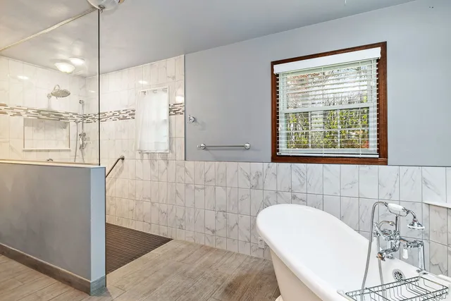 a bathroom with a bathtub and a sink