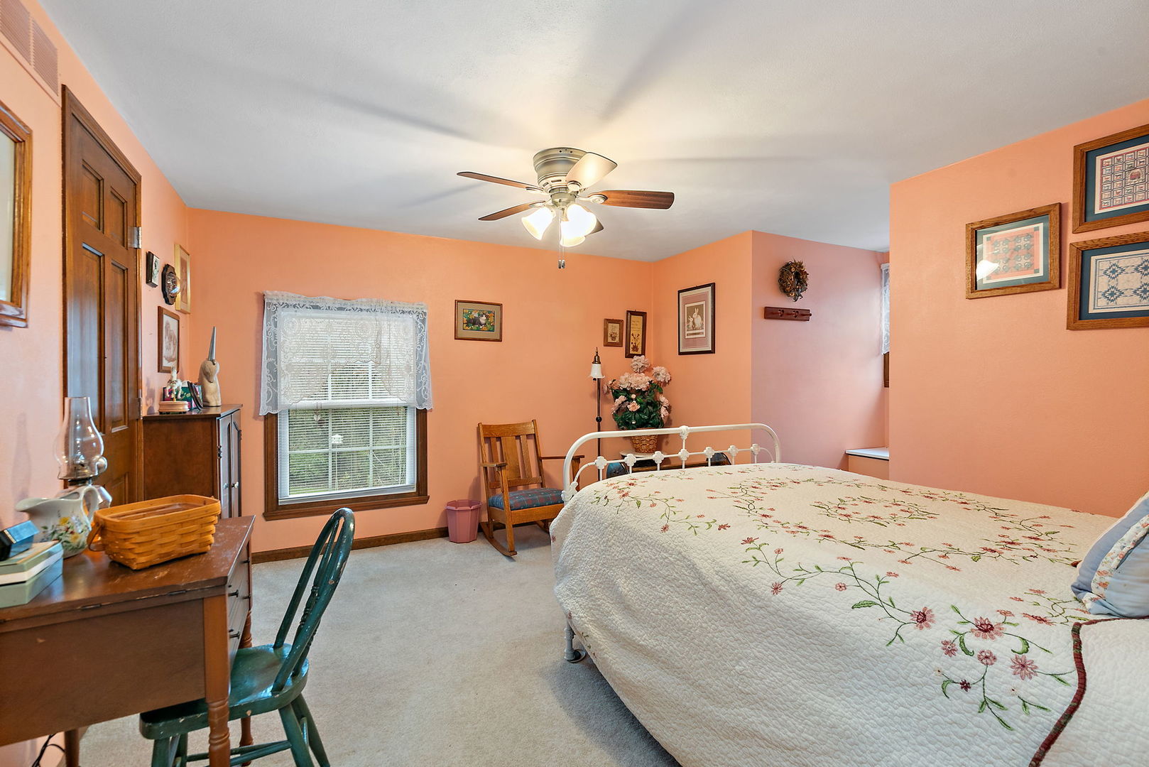 1313 Woods Road Belvidere, IL 61008 - Photo 17 of 50 a bedroom with a bed and a chandelier