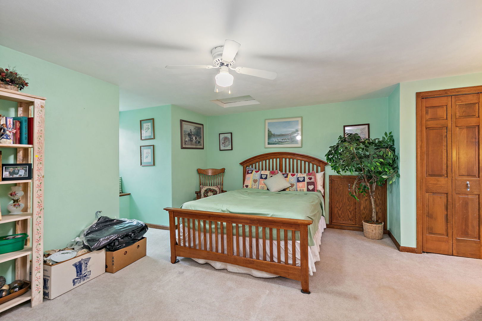 1313 Woods Road Belvidere, IL 61008 - Photo 19 of 50 a bedroom with a bed and a chandelier