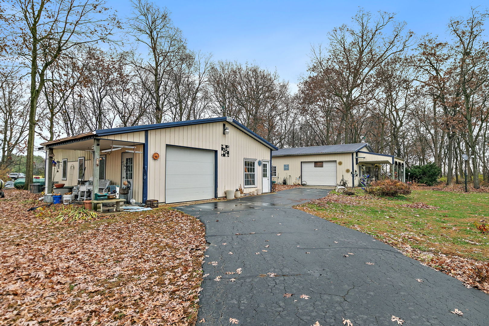 1313 Woods Road Belvidere, IL 61008 - Photo 27 of 50 a view of a house with a yard covered in the forest