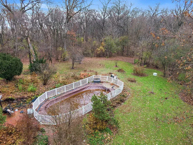 an aerial view of a house with outdoor space