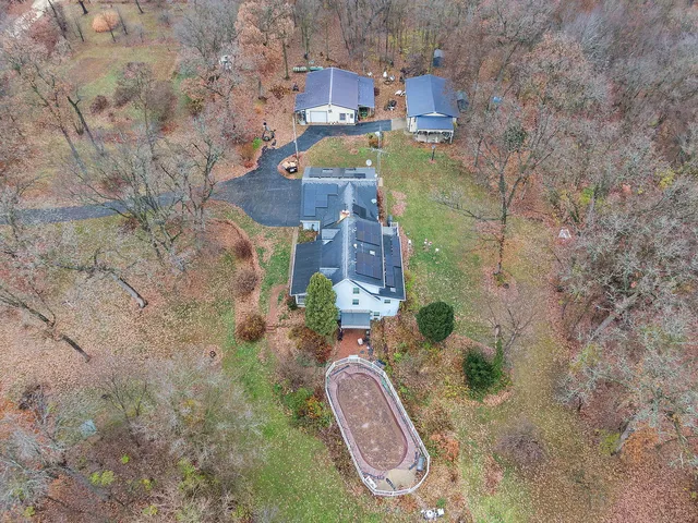 a backyard of a house with oven and a yard