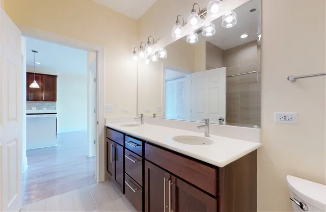 a view of hallway with wooden floor