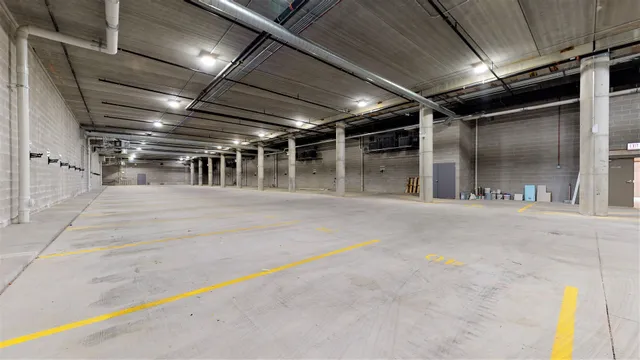 a kitchen with stainless steel appliances granite countertop a stove microwave refrigerator and sink