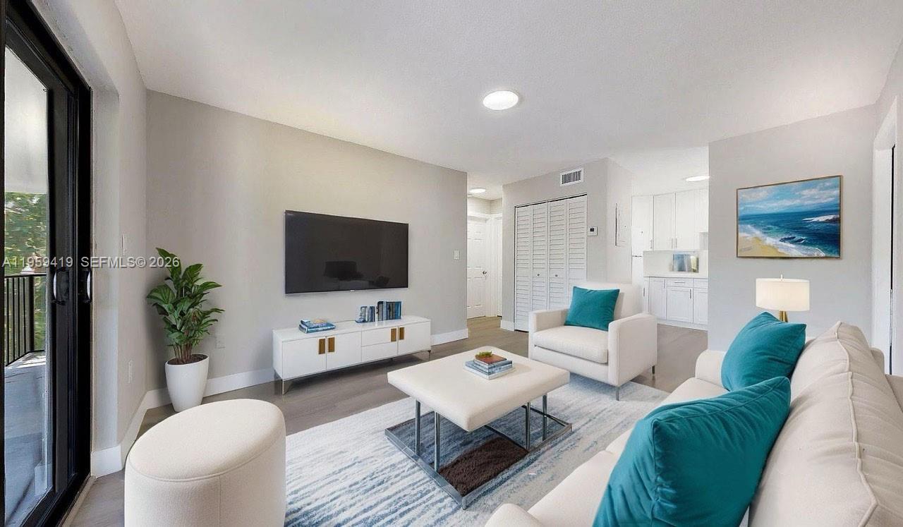 329 Southwest 9th Avenue Miami, FL 33130 - Photo 25 of 97 a living room with furniture flat screen tv and a large window