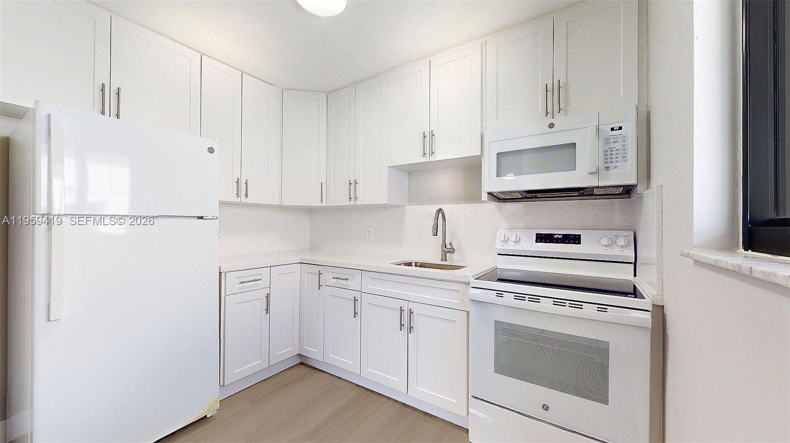329 Southwest 9th Avenue Miami, FL 33130 - Photo 29 of 97 a kitchen with cabinets appliances and a sink