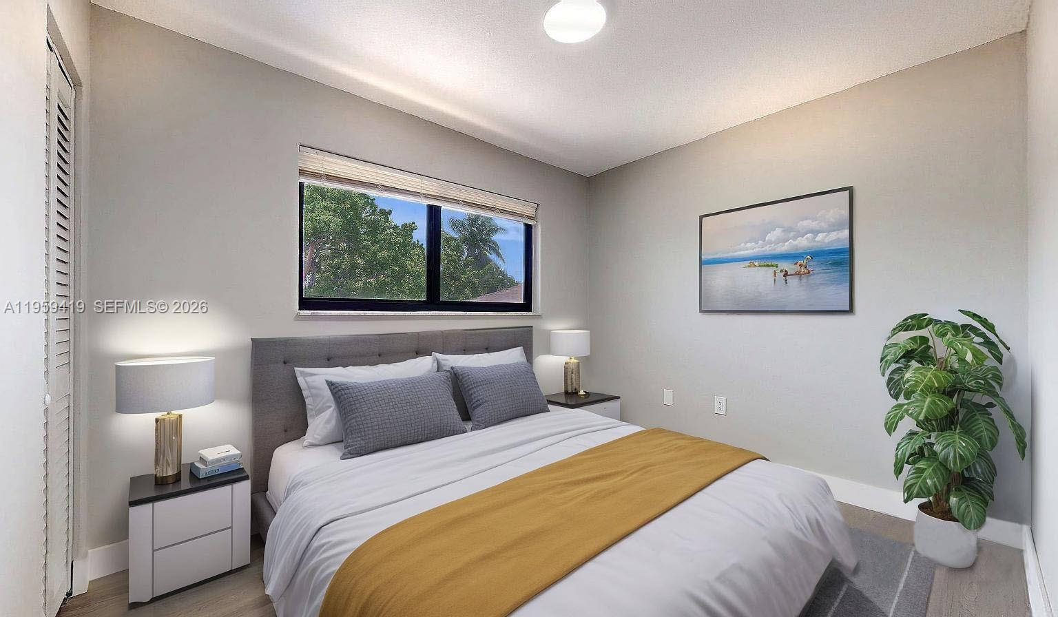 329 Southwest 9th Avenue Miami, FL 33130 - Photo 38 of 97 a bedroom with a bed and a painting on the wall