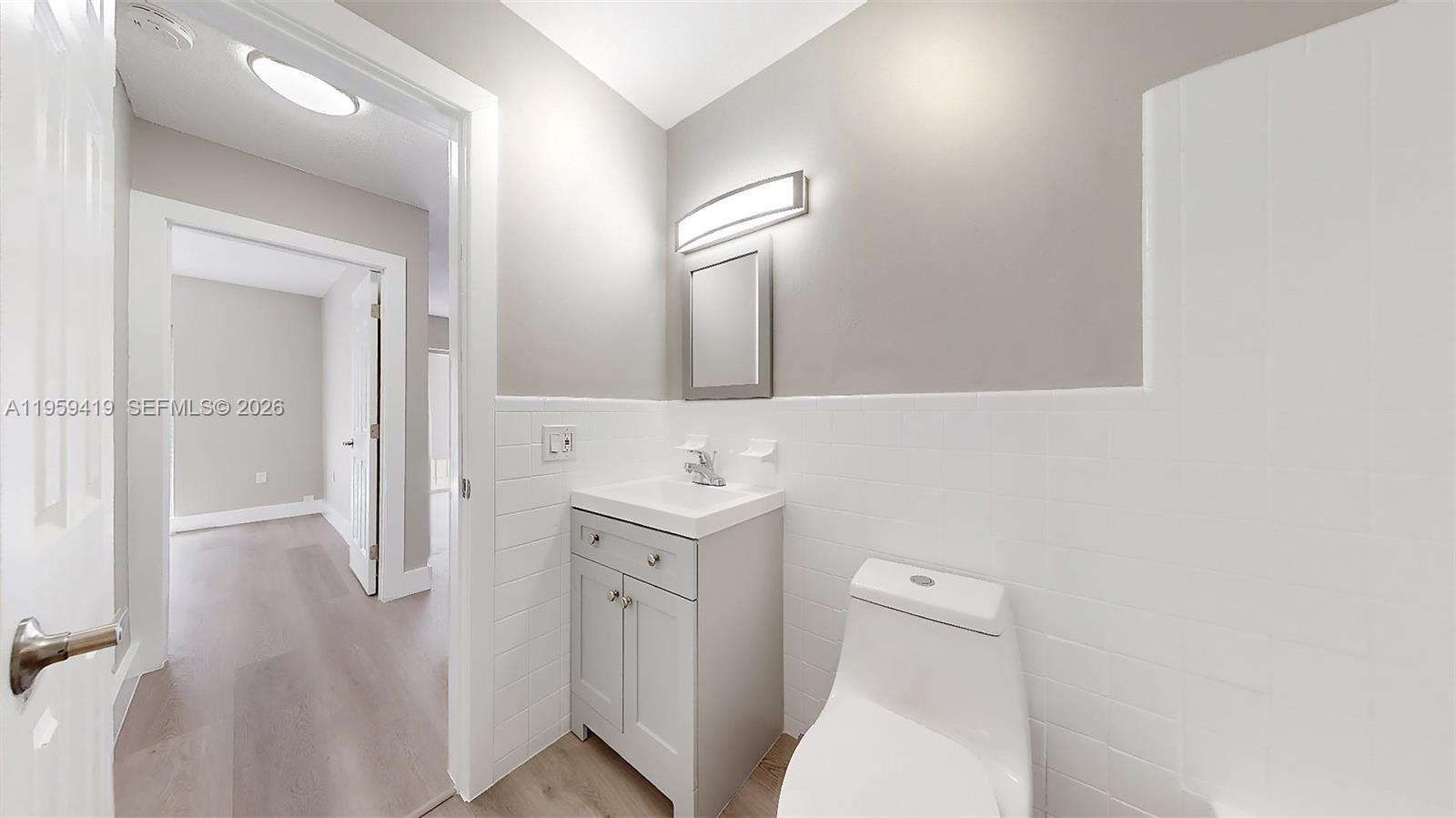 329 Southwest 9th Avenue Miami, FL 33130 - Photo 44 of 97 a bathroom with a toilet sink and mirror