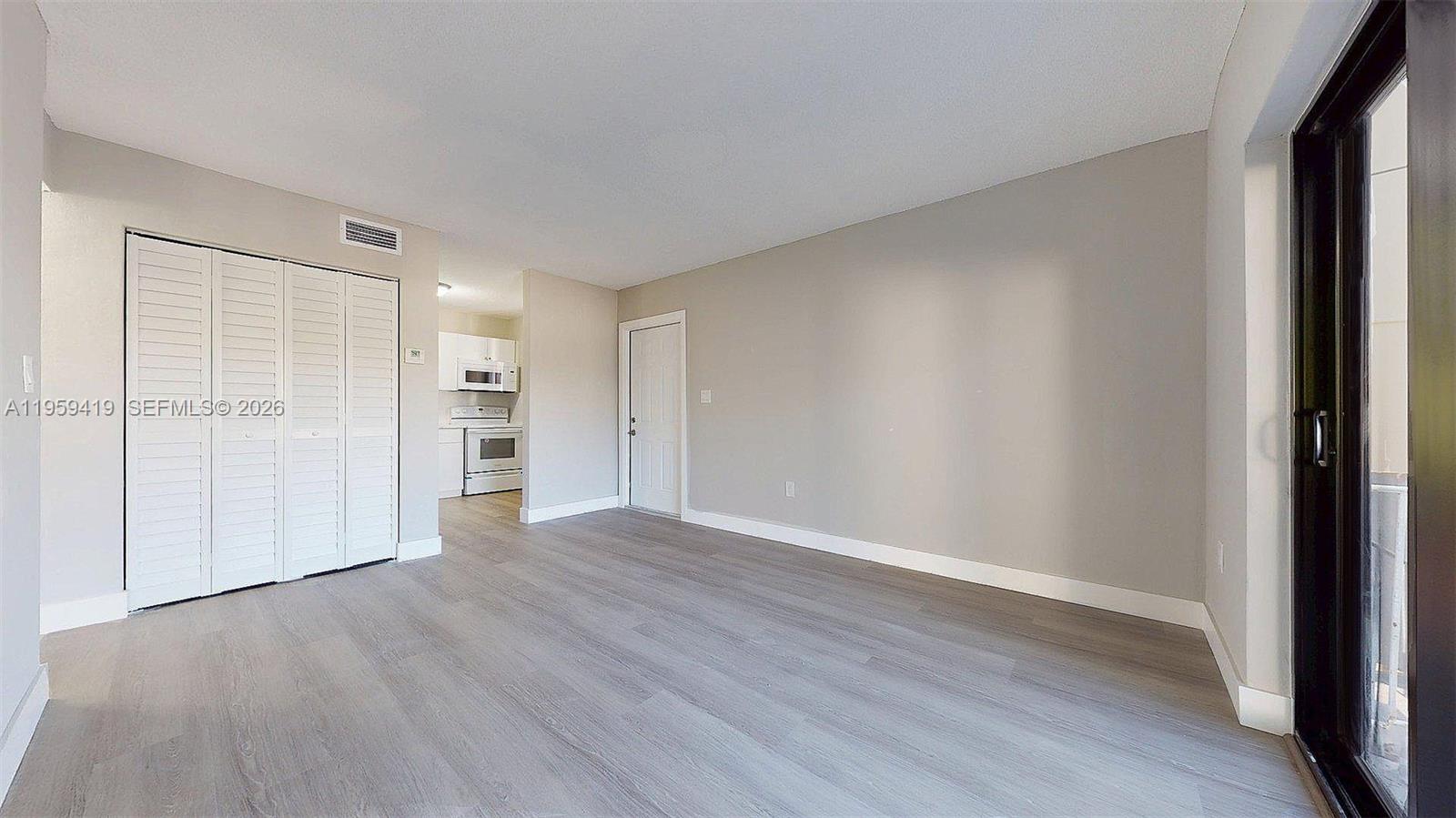 329 Southwest 9th Avenue Miami, FL 33130 - Photo 67 of 97 a view of an empty room with wooden floor and closet area