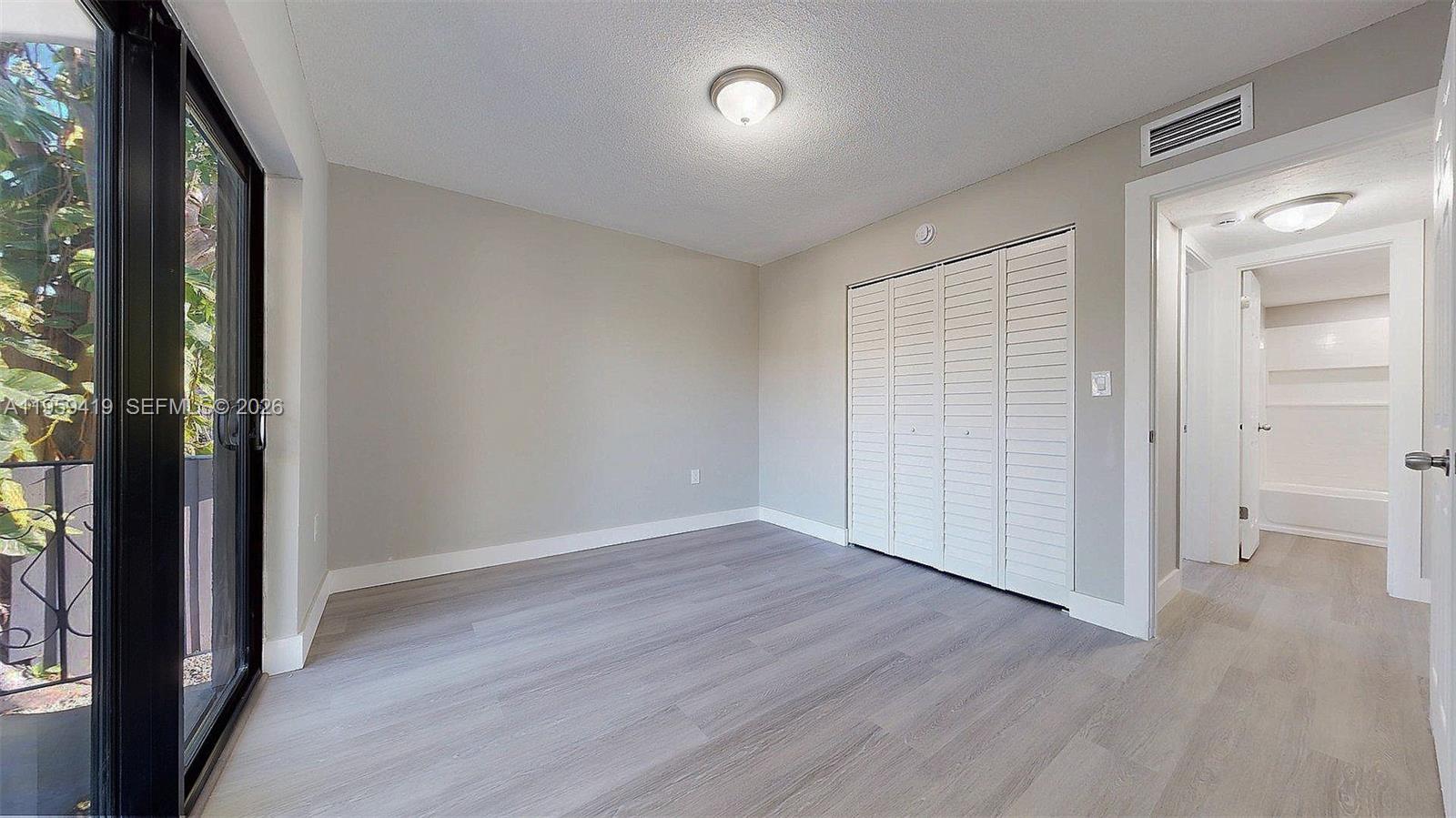 329 Southwest 9th Avenue Miami, FL 33130 - Photo 80 of 97 wooden floor in an empty room