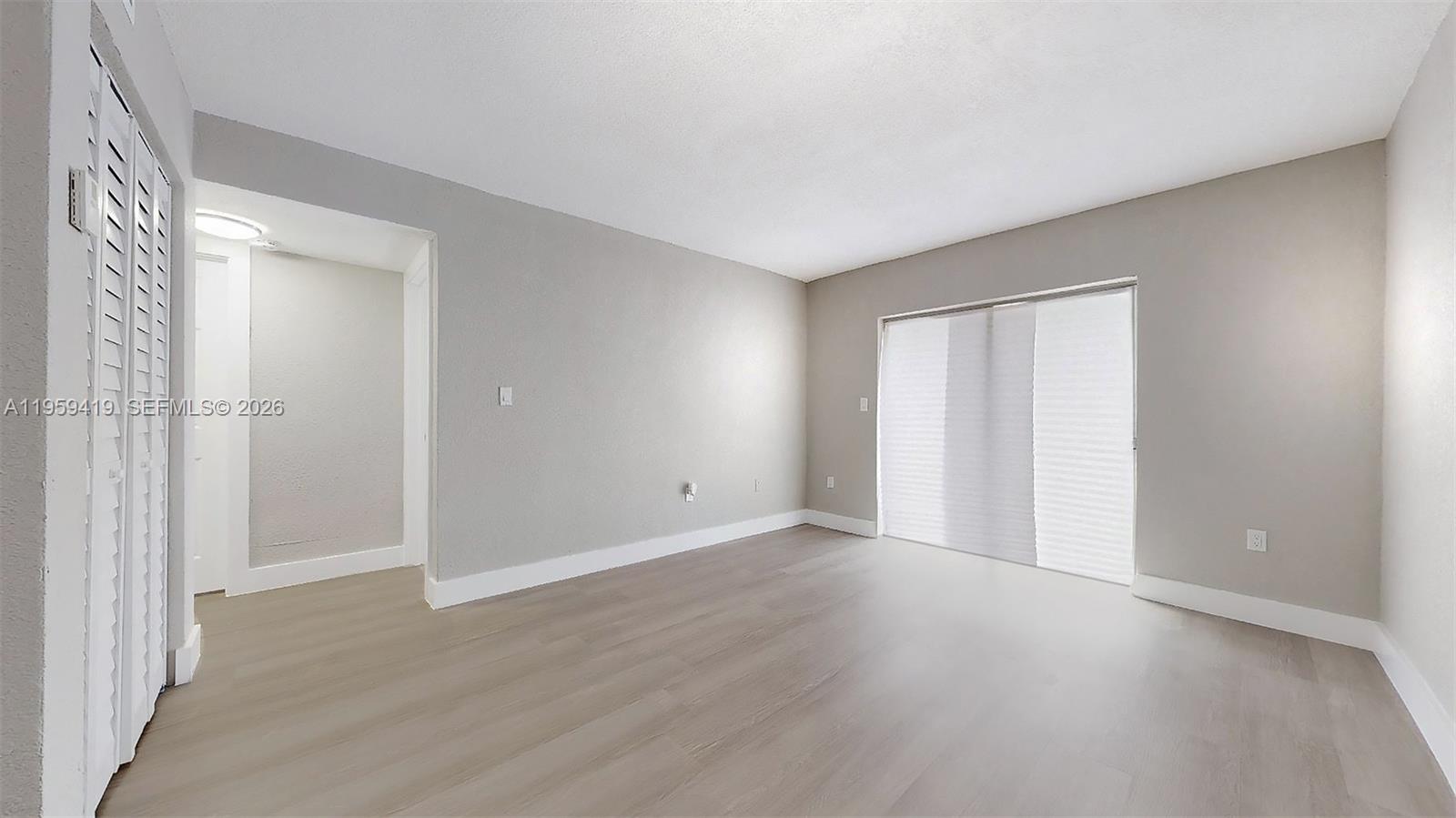 329 Southwest 9th Avenue Miami, FL 33130 - Photo 86 of 97 a view of an empty room with wooden floor and a window