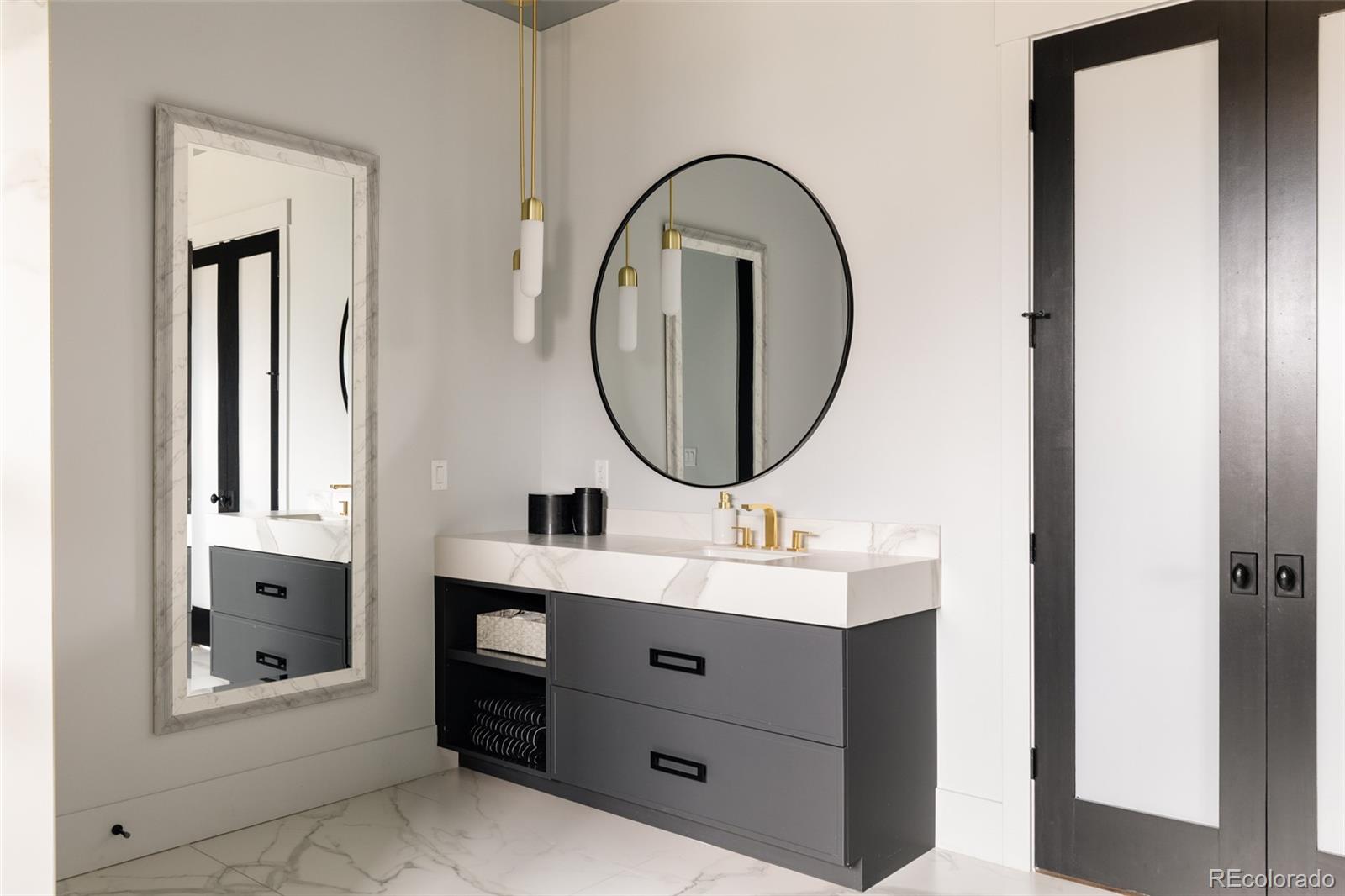 2531 Southwind Road Berthoud, CO 80513 - Photo 15 of 49 a bathroom with a sink and a mirror