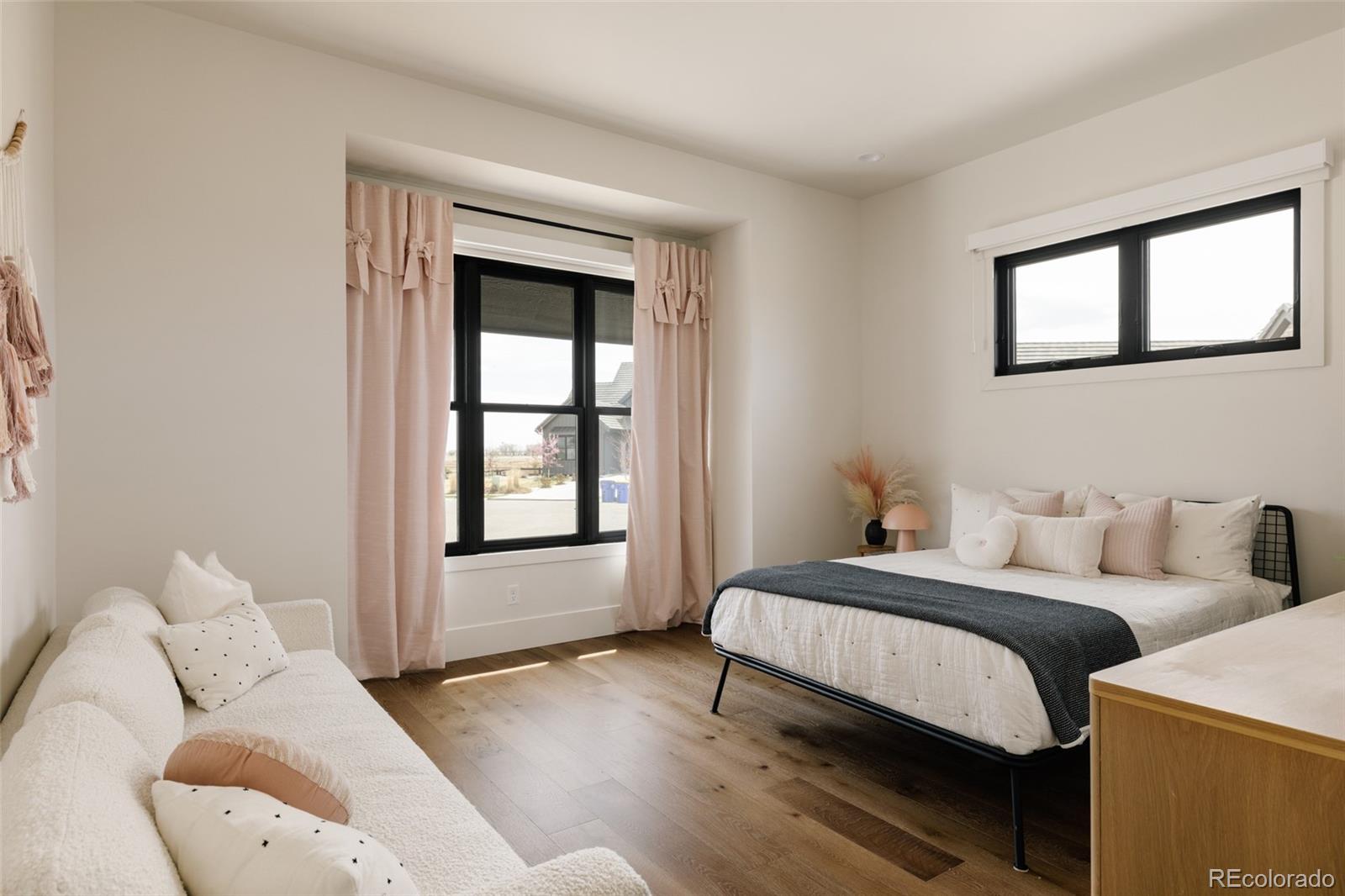 2531 Southwind Road Berthoud, CO 80513 - Photo 17 of 49 a bedroom with a bed and a large window