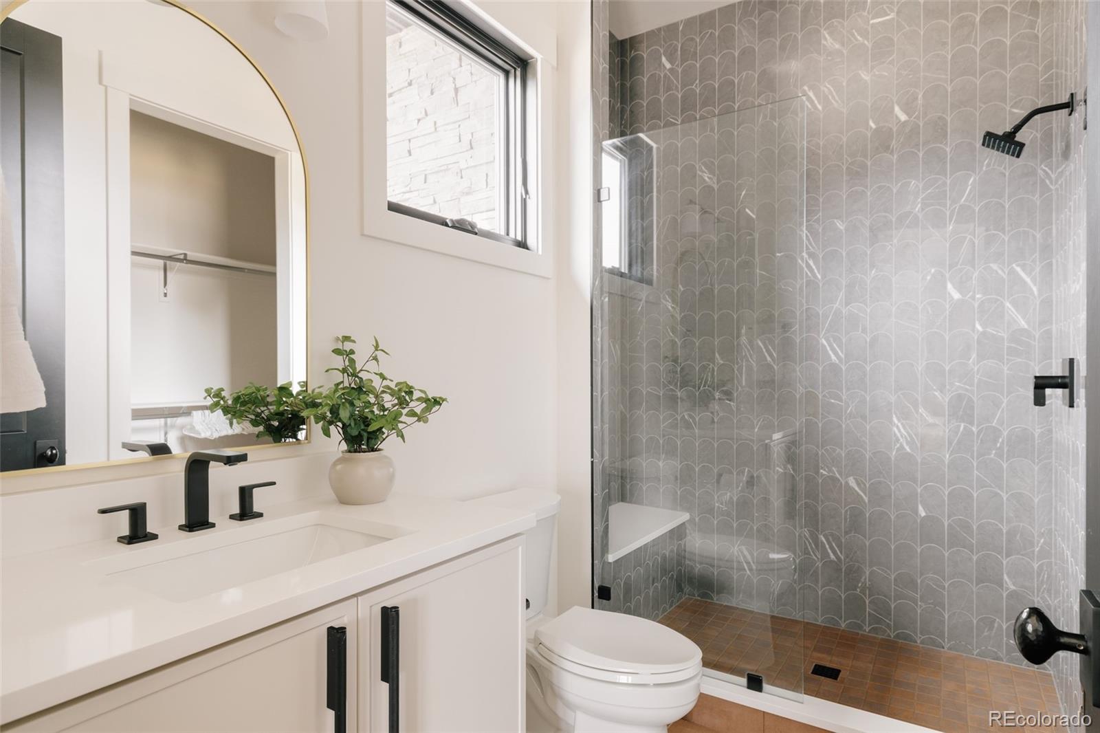 2531 Southwind Road Berthoud, CO 80513 - Photo 19 of 49 a bathroom with a sink a toilet and shower